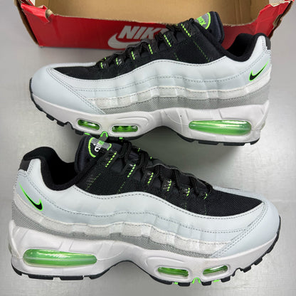 Nike Air Max 95 black trainers with green strike accents and textured upper.