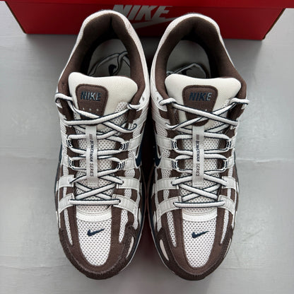 Nike deck shoes brown with white accents and logo detail.