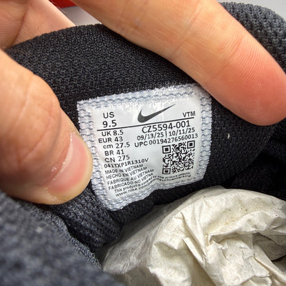 Nike athletic shoes black leather with Air Max branding and textured design.