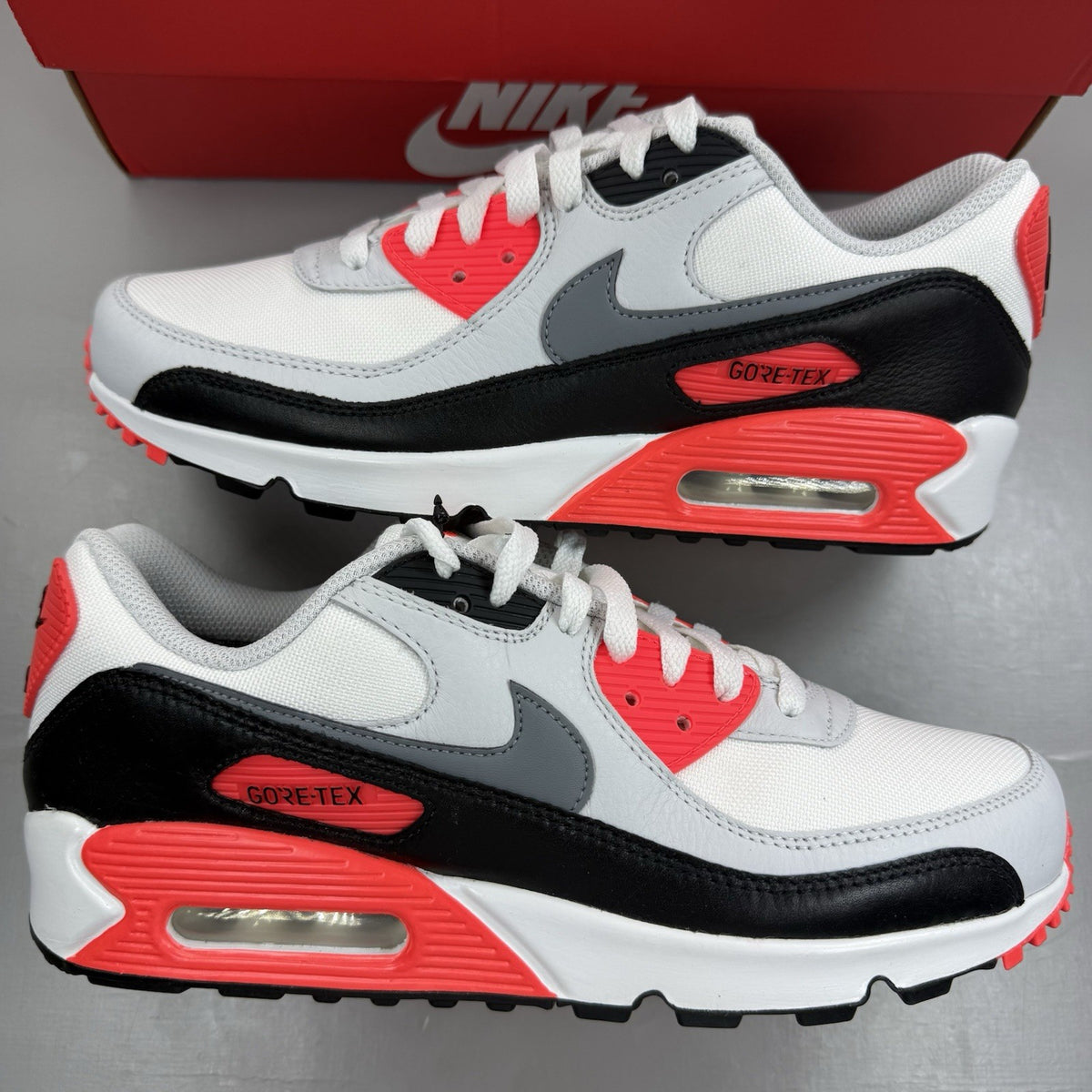 Nike Air Max 90 trainers white GORE-TEX with infrared accents and grey details.