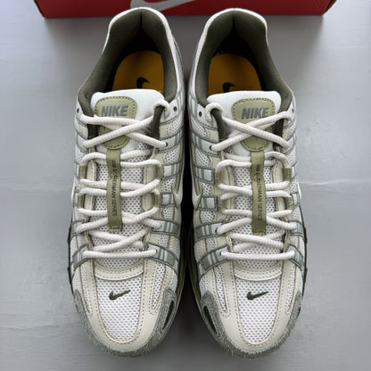 Nike white trainers with light army accents and breathable mesh upper.