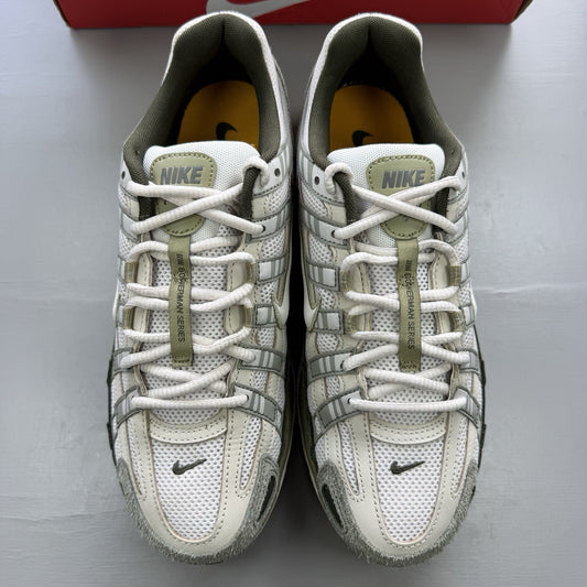 Nike white trainers with light army accents and breathable mesh upper.