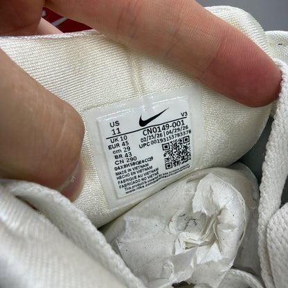Nike deck shoes metallic silver with black and white accents, featuring logo details.