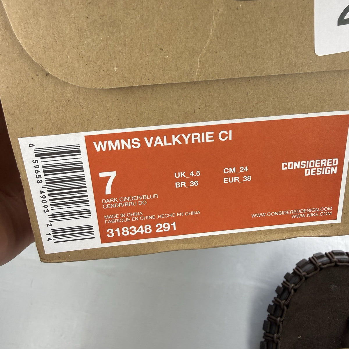 Nike ACG Valkyrie CI slides dark cinder brown with logo detail and textured material.