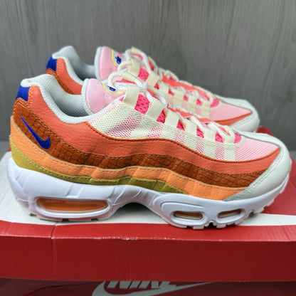 Nike Air Max 95 trainers white with campfire orange accents and signature logo details.