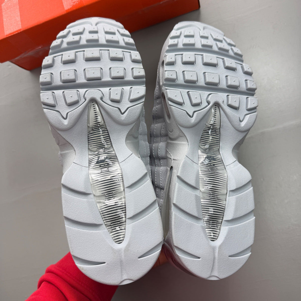 Nike grey deck shoes with big bubble sole and classic logo detail.