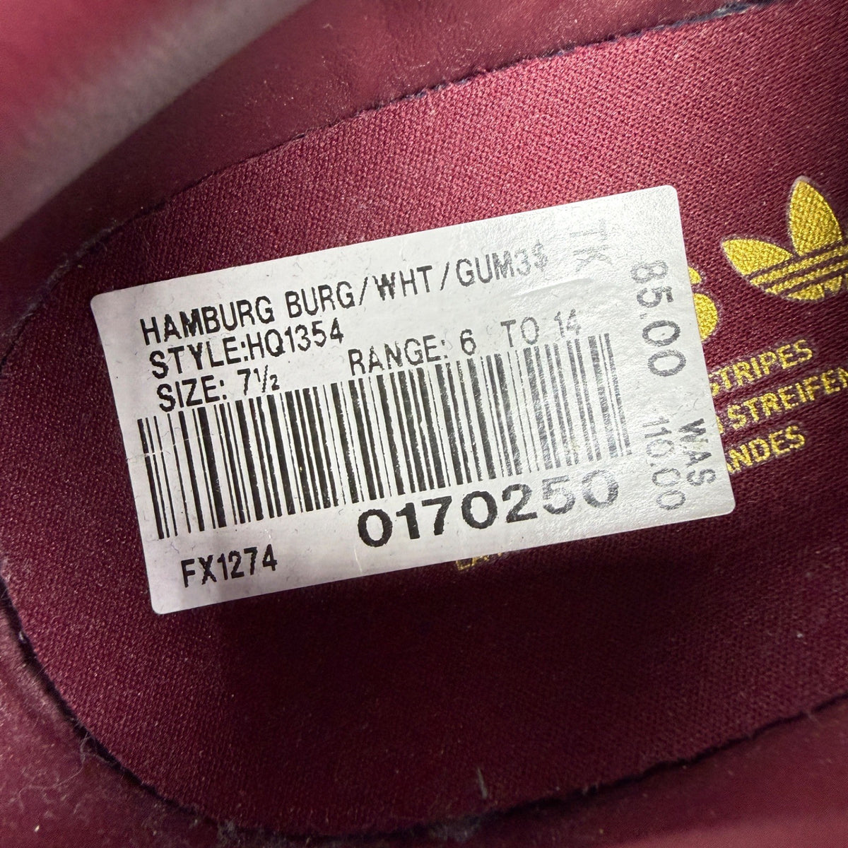 Adidas red athletic shoes with white stripes and gum sole, size UK 7.5.