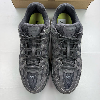 Nike black trainers with reflective detailing and logo on the side.
