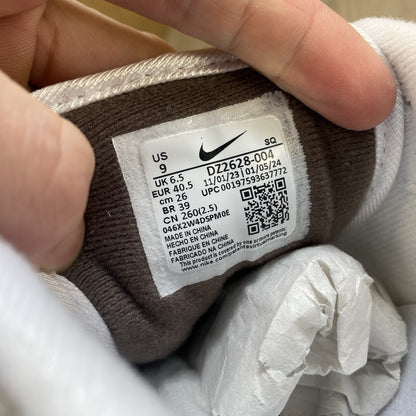 Nike Air Max 1 '87 trainers white with grey accents and brown detailing.