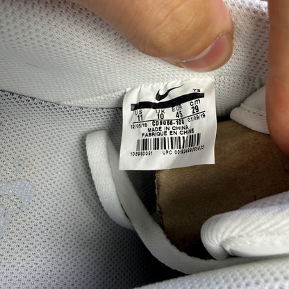 Nike Air Force 1 white trainers with pure platinum grey accents and classic logo.