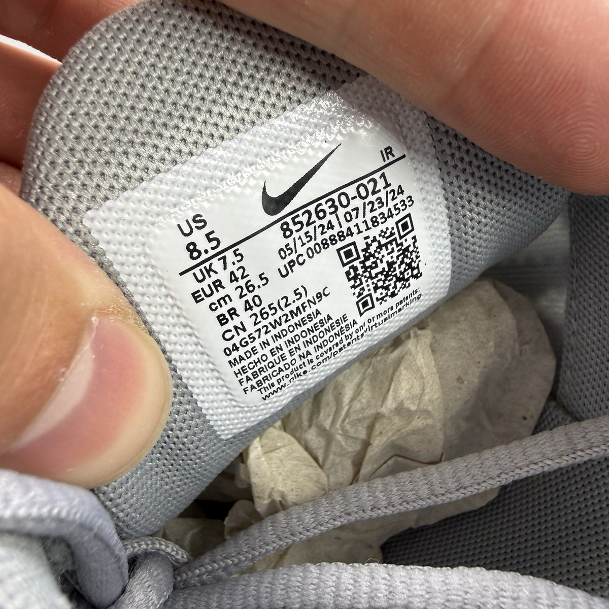 Nike Air Max Plus TN grey trainers mismatched sizes with distinctive logo and sleek design.
