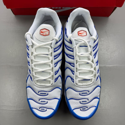 Nike trainers white with signal blue accents and distinctive Air Max Plus design.