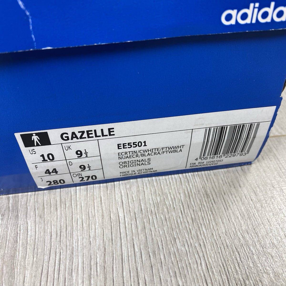 Adidas Gazelle trainers ecru tint with white stripes and suede upper material.
