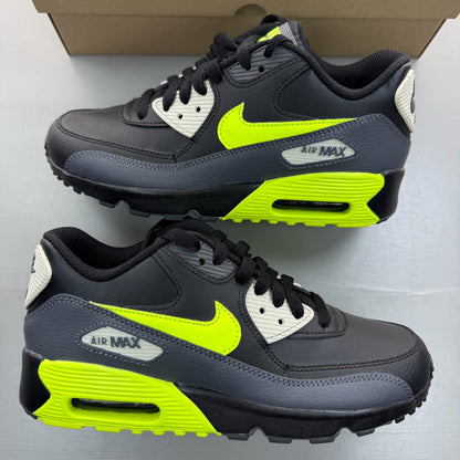 Nike Air Max 90 black trainers with volt accents and signature logo detailing.