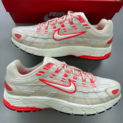 Nike P-6000 trainers white with red accents and mesh detailing, brand logo on tongue.