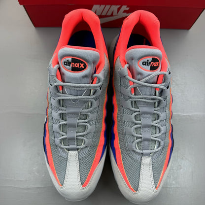 Nike Air Max 95 grey sneakers with Ultramarine and Platinum accents, featuring logo detail.