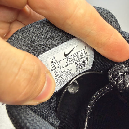 Nike Air Max 95 black trainers with grey and white accents, featuring iconic logo details.