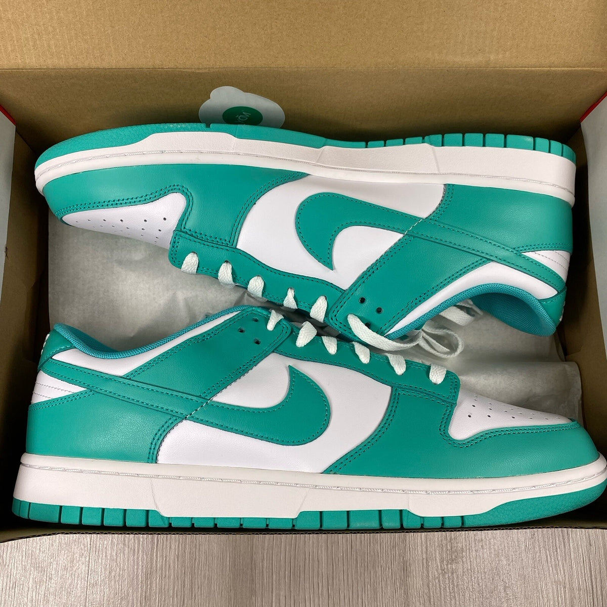 Nike Dunk Low trainers white with clear jade accents and signature swoosh logo.