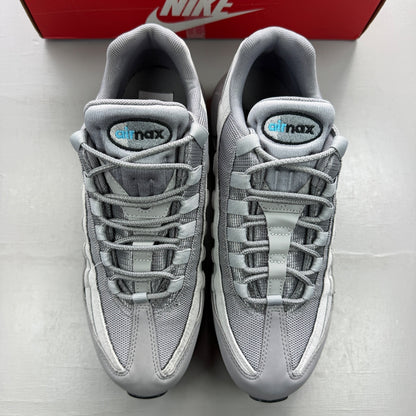 Nike trainers grey with aqua accents and retro logo detailing.