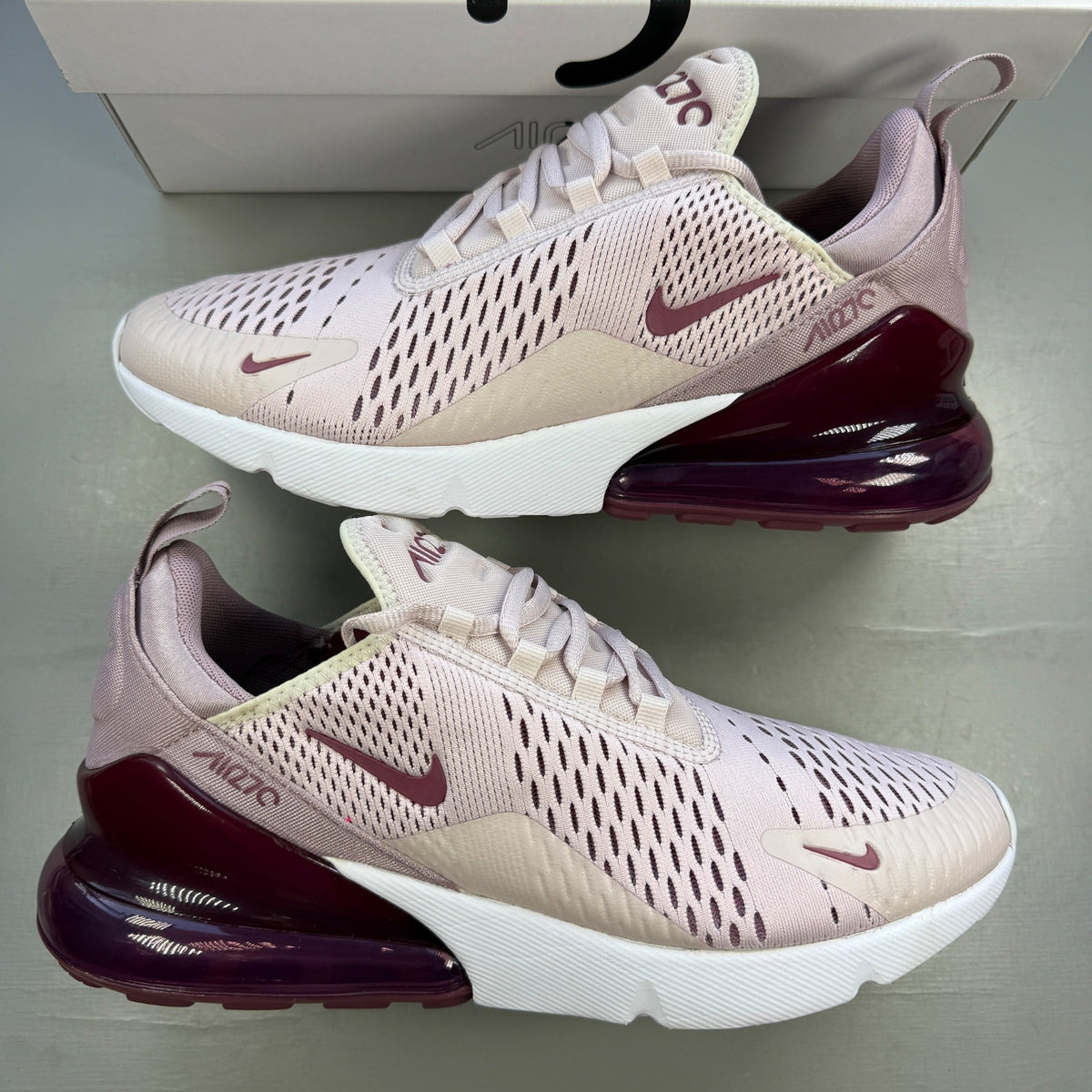 Nike trainers barely rose pink with white accents and Air Max cushioning.