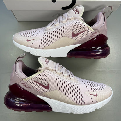 Nike trainers barely rose pink with white accents and Air Max cushioning.