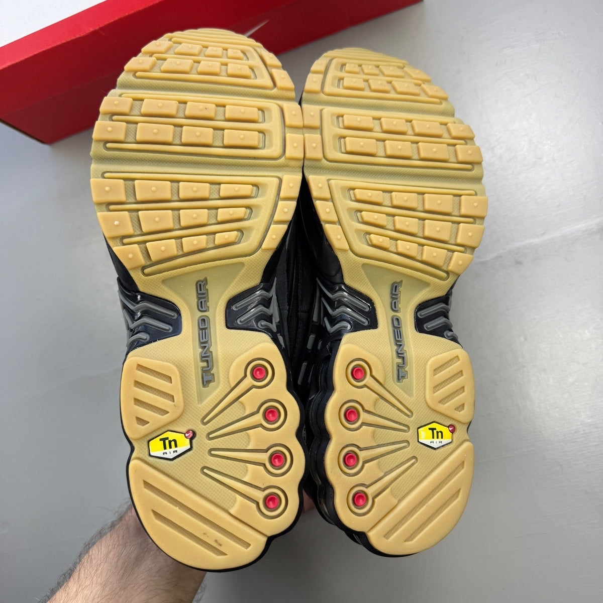 Nike deck shoes black with grey accents and gum sole, featuring iconic logo.