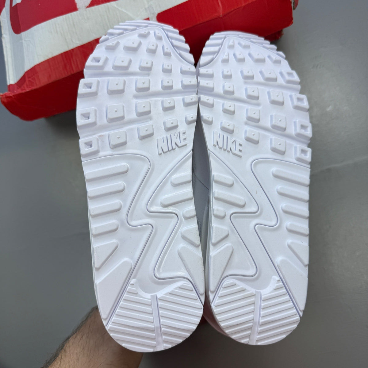 Nike deck shoes white leather with logo and minimalist design.