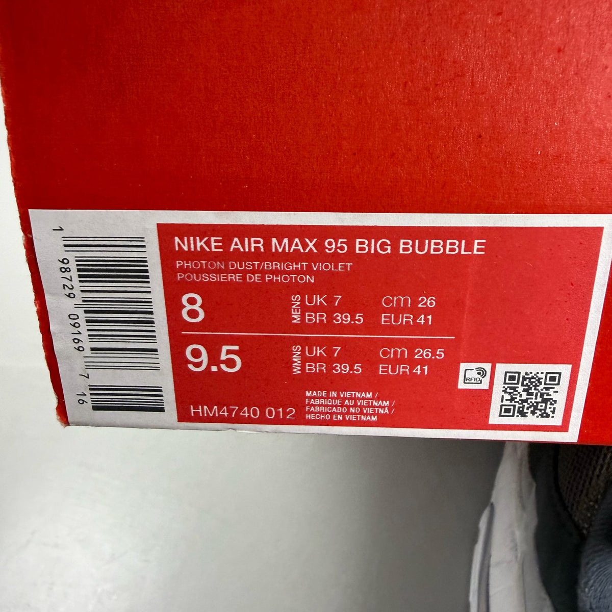 Nike Air Max 95 grey trainers with big bubble sole and logo detailing.