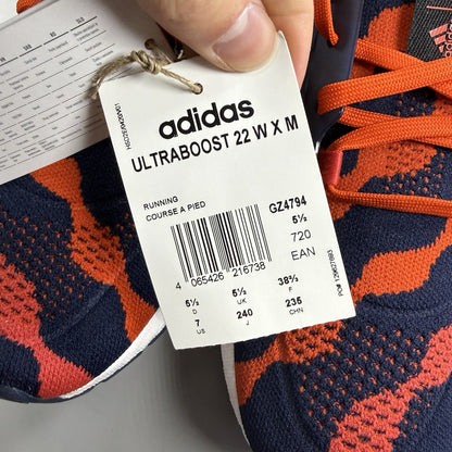 Adidas red Ultra Boost 22 trainers with Marimekko floral pattern and Parley branding.