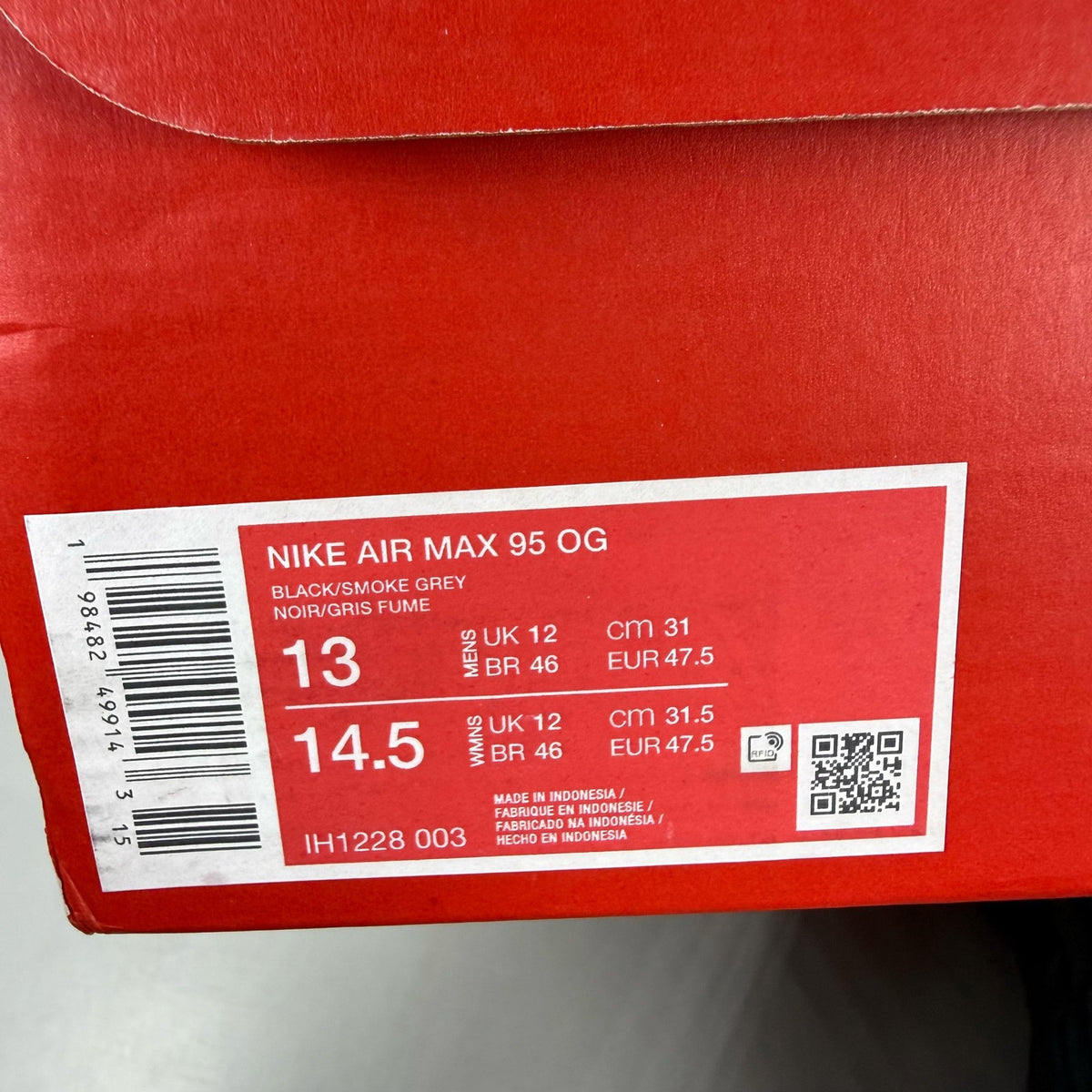 Nike Air Max 95 black sneaker with university red accents and big bubble sole design.