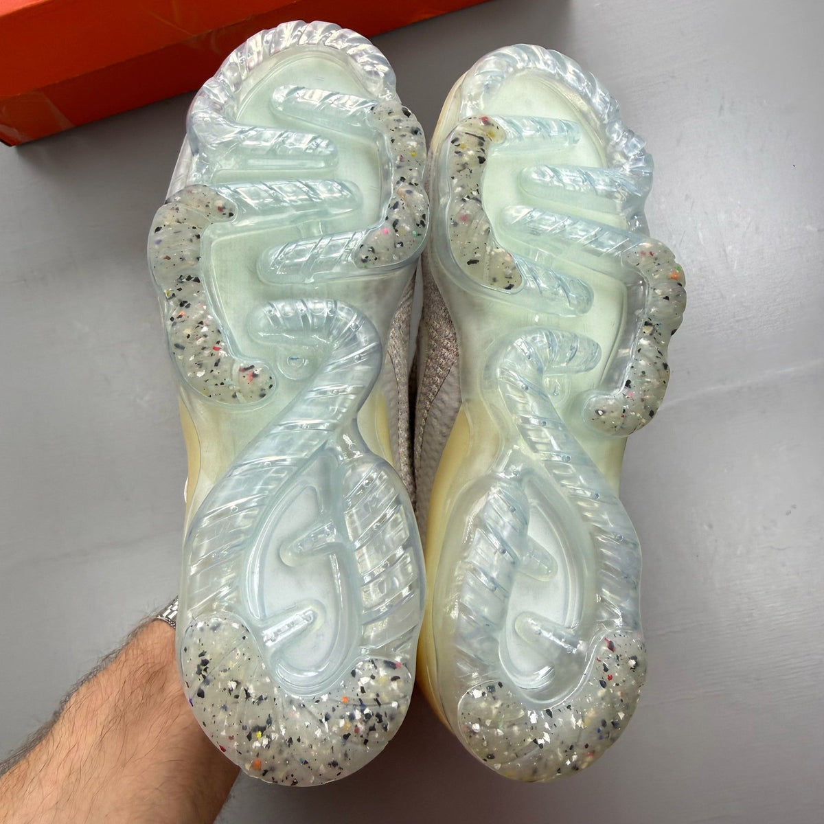 Nike Air VaporMax 2021 FK white trainers with breathable knit upper and signature swoosh logo.