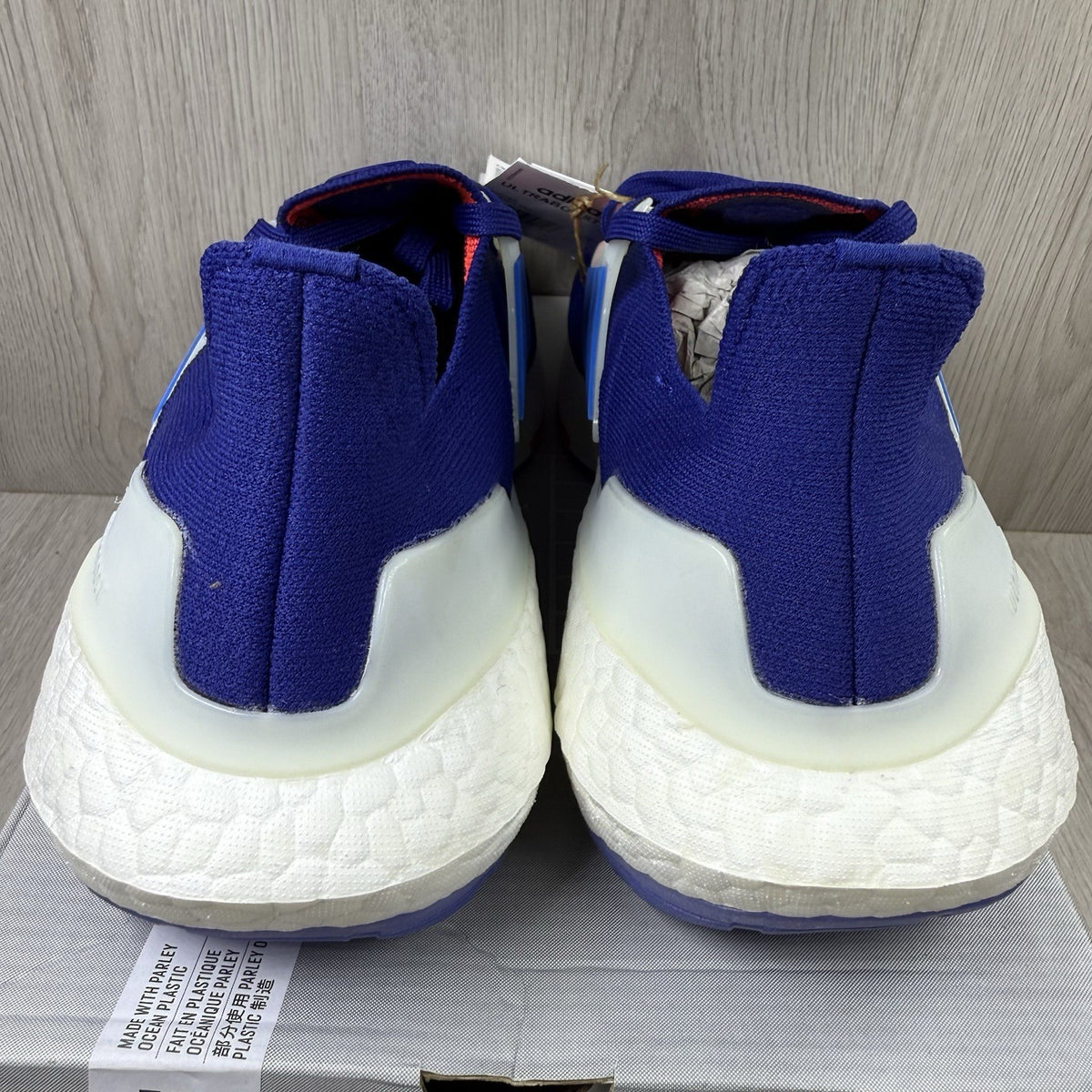 Adidas Ultra Boost 22 trainers in legacy indigo with turbo blue and white accents.