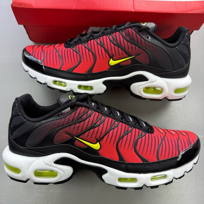 Nike Air Max Plus TN red trainers with black accents and vibrant volt detailing.