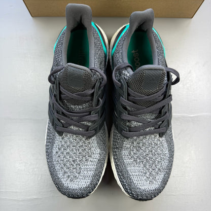 Adidas Ultra Boost 2.0 grey trainers with shock mint accents and logo detailing.