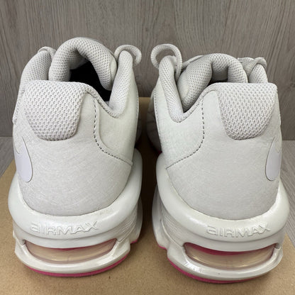 Nike Air Max trainers beige with pink accents and logo detail on the side.