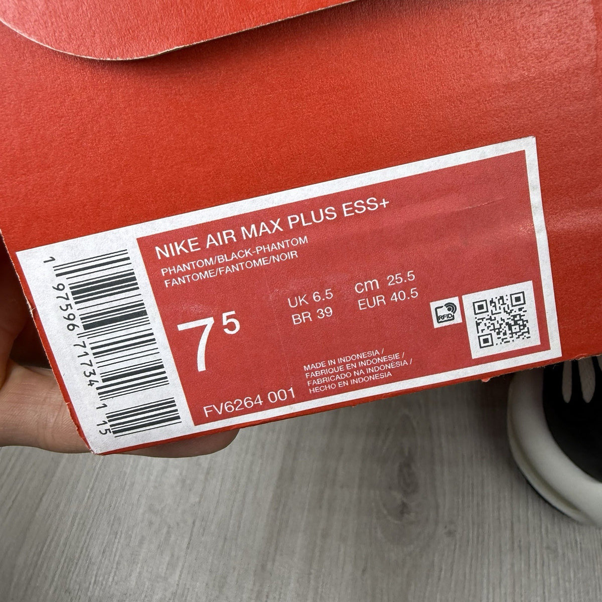 Nike Air Max Plus TN ESS trainers white with black accents and signature swoosh logo.