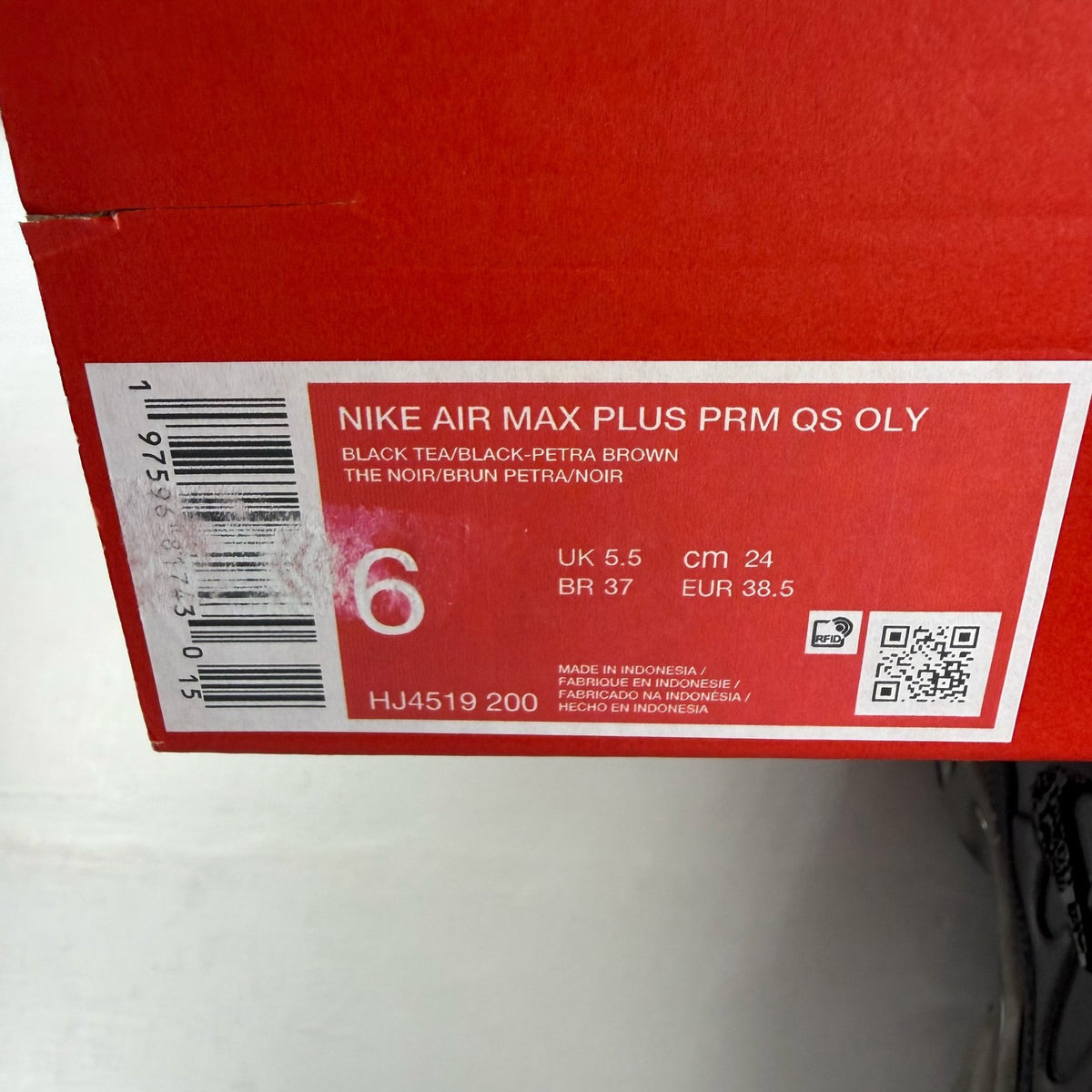 Nike Air Max Plus TN Premium black trainers with signature logo and sleek design.