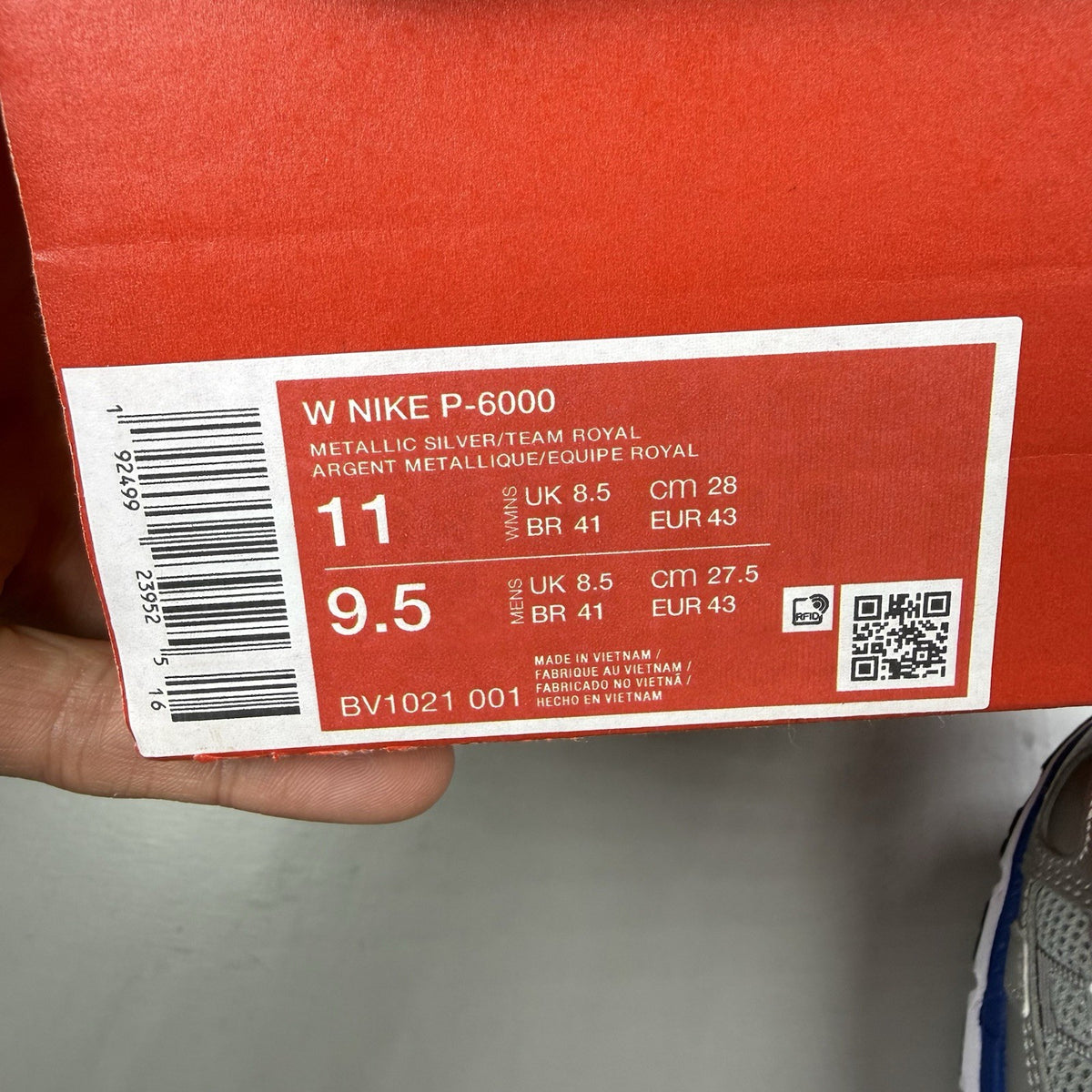 Nike P-6000 trainers white with laser blue and silver accents, mesh material, logo detail.