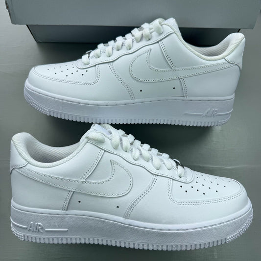 Nike Air Force 1 '07 white trainers with classic silhouette and embossed logo.