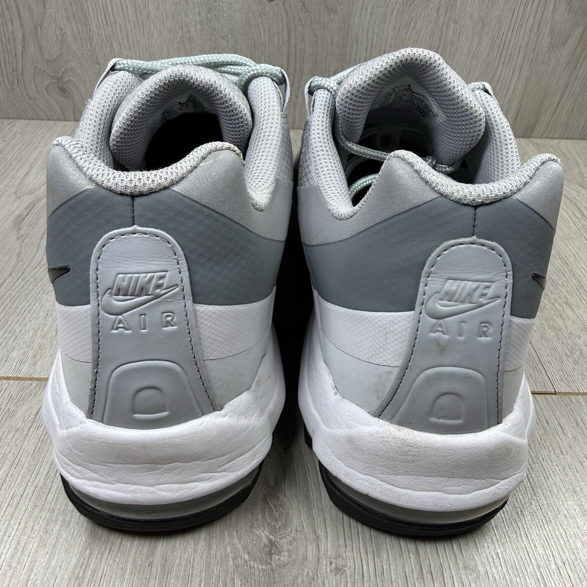 Nike Air Max 95 Ultra grey trainers with white accents and signature logo detailing.