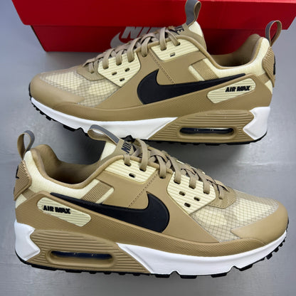 Nike Air Max 90 beige sneakers with black accents and khaki details.
