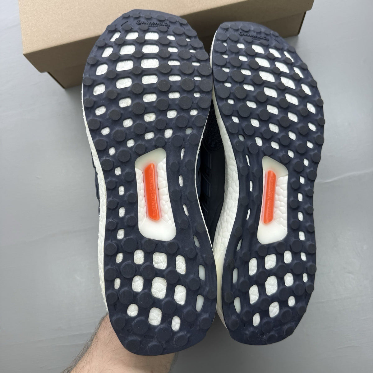 Adidas Ultra Boost 5.0 DNA trainers in navy blue with white accents and logo.
