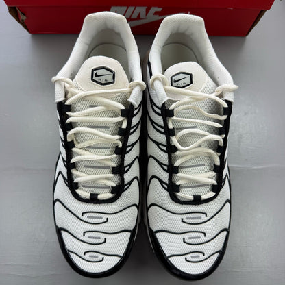 Nike Air Max Plus TN trainers white with black accents and signature logo.
