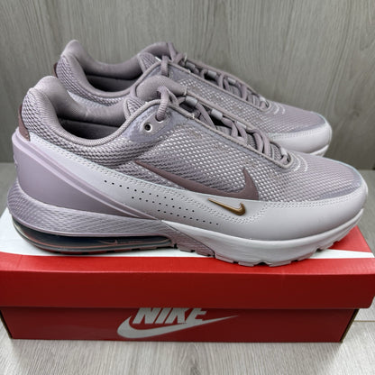 Nike Air Max Pulse purple trainers with unique design and textured material.