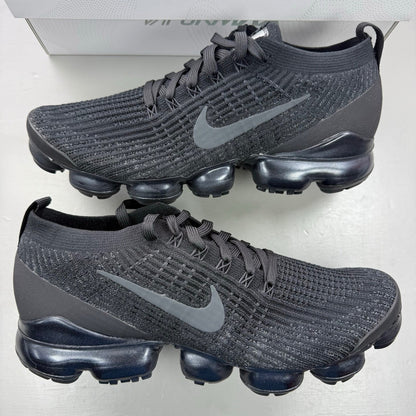 Nike Air VaporMax Flyknit 3 black sneakers with distinctive air cushioning and sleek design.
