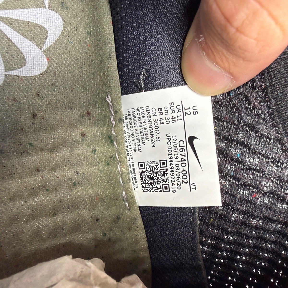 Nike black trainers Flyknit upper with grey accents and Air Max cushioning.