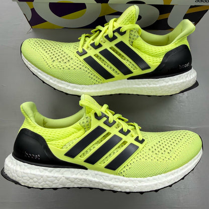 Adidas UltraBoost 1.0 yellow trainers with black and white accents, mesh upper.