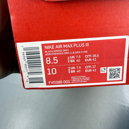 Nike deck shoes black with grey accents and gum sole, featuring iconic logo.