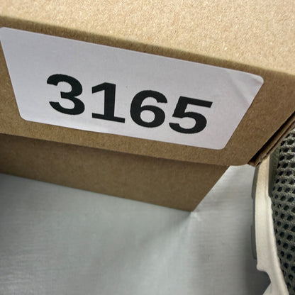 Nike trainers khaki green mesh upper with white sole and logo details.