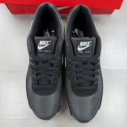 Nike Air Max 90 black trainers with grey accents and signature swoosh logo.